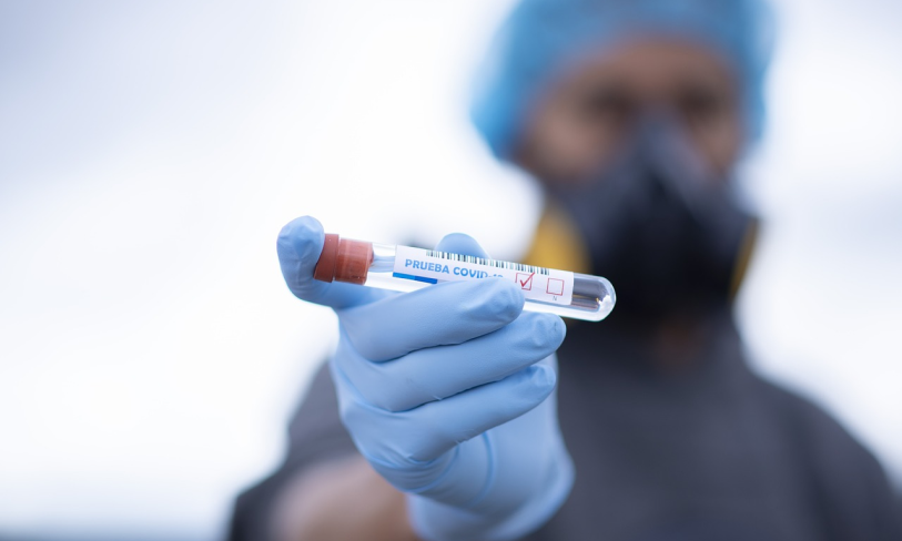 Medical professional holding test tube